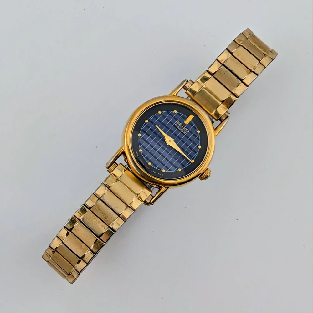 Vintage Seiko 1N00-0F60 Blue Woven Grid Textured Dial Gold Tone Watch 20mm